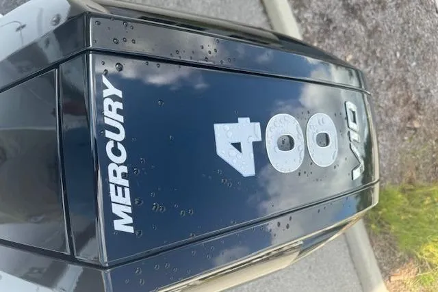 Slide: The Image of 2025 Sportsman Masters 267OE Bay Boat trailer hitch with reflectors on asphalt. - 8