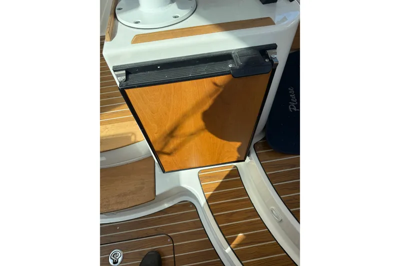 Slide: The Image of 2014 Back Cove 37 boat interior with wooden panel and teak flooring. - 11