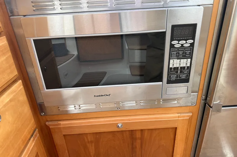 Slide: The Image of Built-in Franklin Chef microwave in a 2014 Back Cove 37 yacht kitchen. - 14