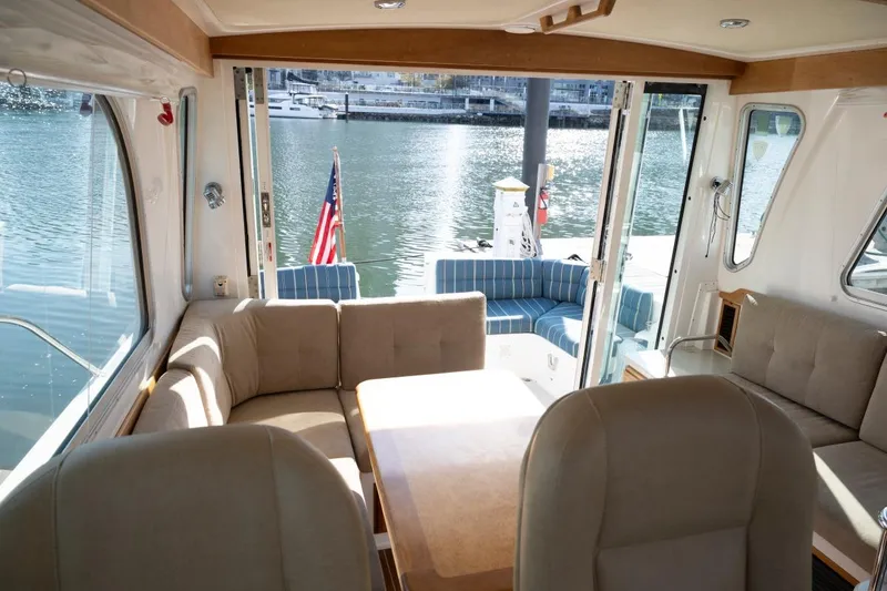 Slide: The Image of Interior view of 2014 Back Cove 37 yacht with waterfront backdrop. - 17