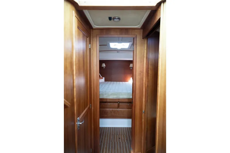 Slide: The Image of Interior cabin view of 2014 Back Cove 37 yacht with wooden finish. - 23