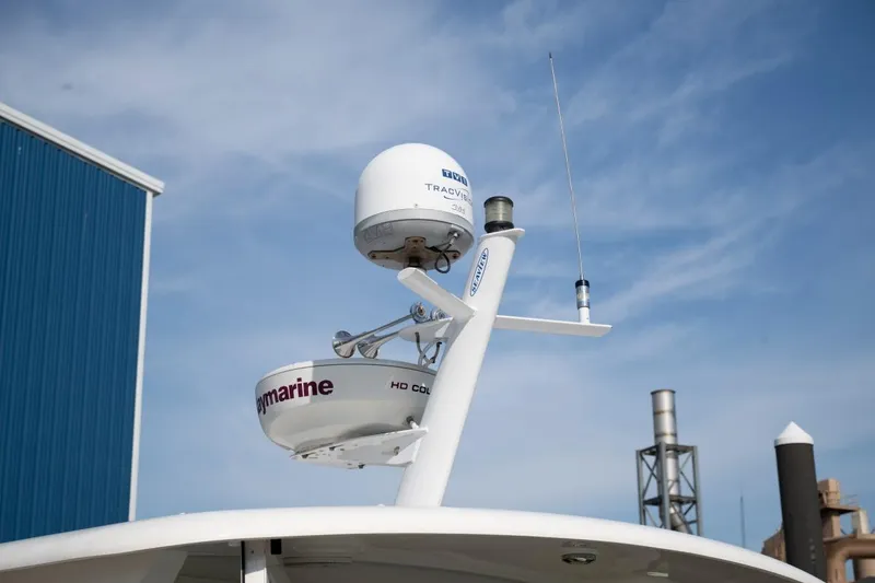 Slide: The Image of 2014 Back Cove 37 boat radar and antenna system under clear sky. - 31