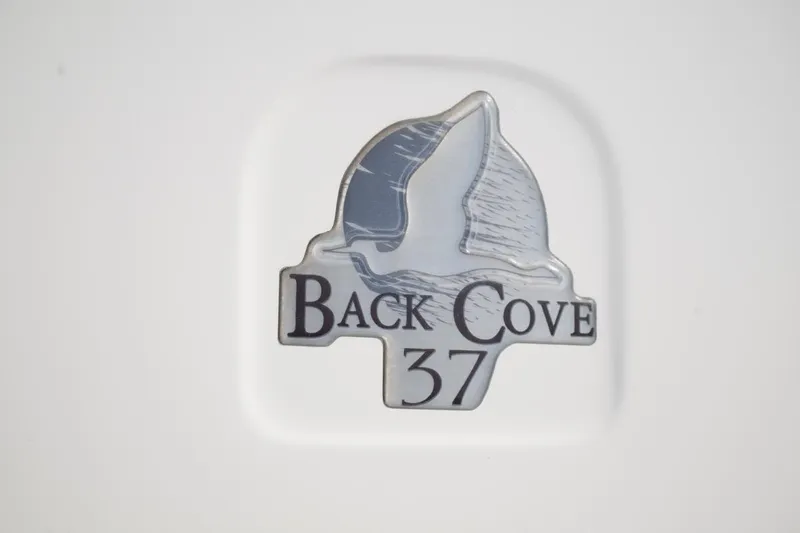Slide: The Image of Back Cove 37 emblem on a 2014 model, featuring a seagull design. - 36