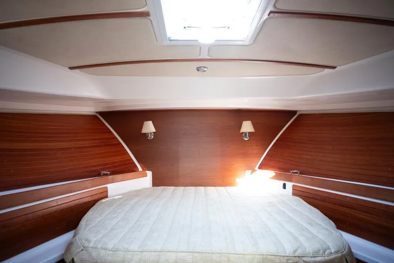 Slide: The Image of Luxurious cabin interior of 2014 Back Cove 37 yacht with wood paneling and cozy bed. - 39