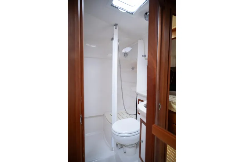 Slide: The Image of Bathroom interior of 2014 Back Cove 37 yacht, featuring shower and toilet. - 47