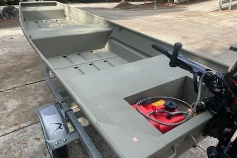 Slide: The Image of 2025 Tracker Grizzly 14 Jon boat on trailer with motor and fuel tank. - 3