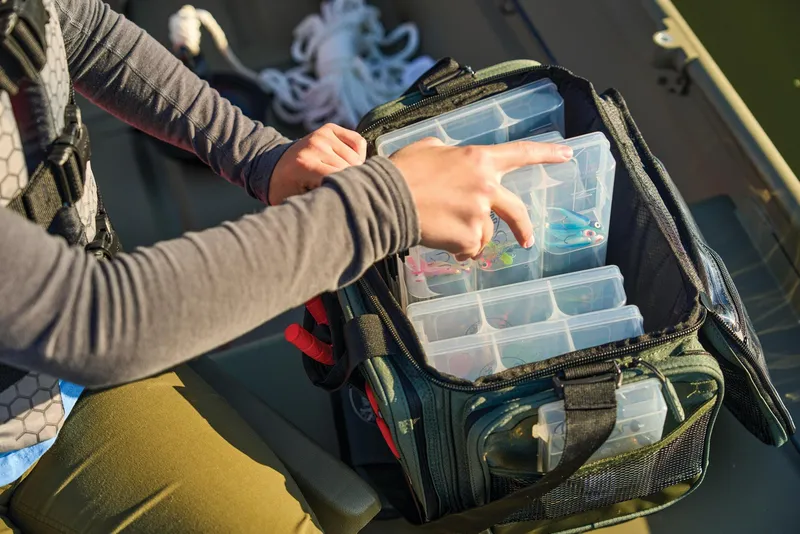 Slide: The Image of Manufacturer Provided Image: Person organizing tackle box on 2025 Tracker Grizzly 14 Jon boat. - 50