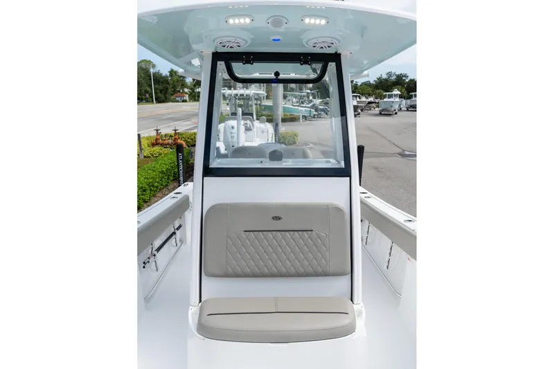 Slide: The Image of 2025 Sportsman Open 212 Center Console boat interior with seating and console view. - 11