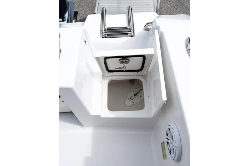 Slide: The Image of 2025 Sportsman Open 212 Center Console boat storage compartment with hatch and ladder. - 14