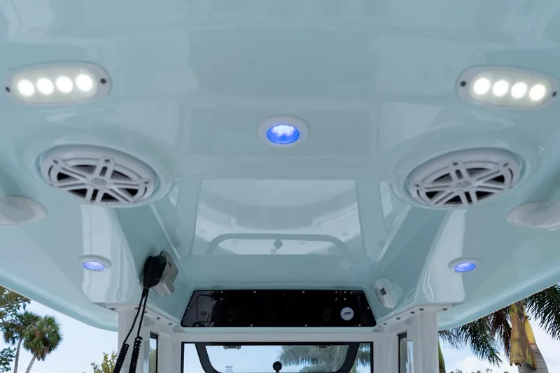 Slide: The Image of 2025 Sportsman Open 212 Center Console boat interior with LED lights and speakers. - 18