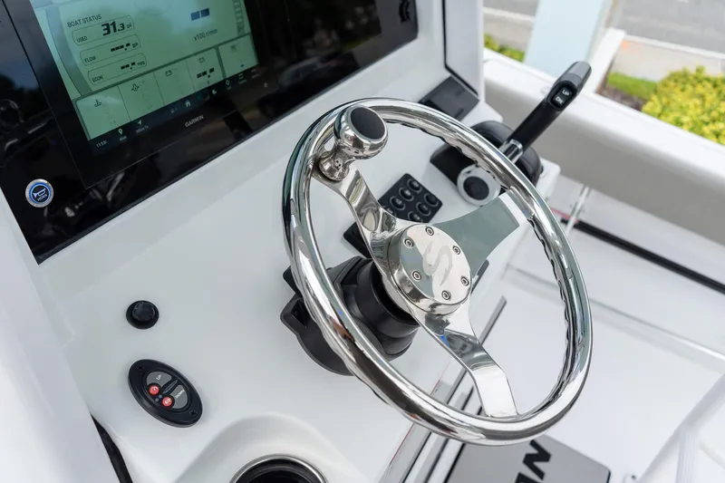 Slide: The Image of 2025 Sportsman Open 212 Center Console steering wheel and dashboard display. - 19