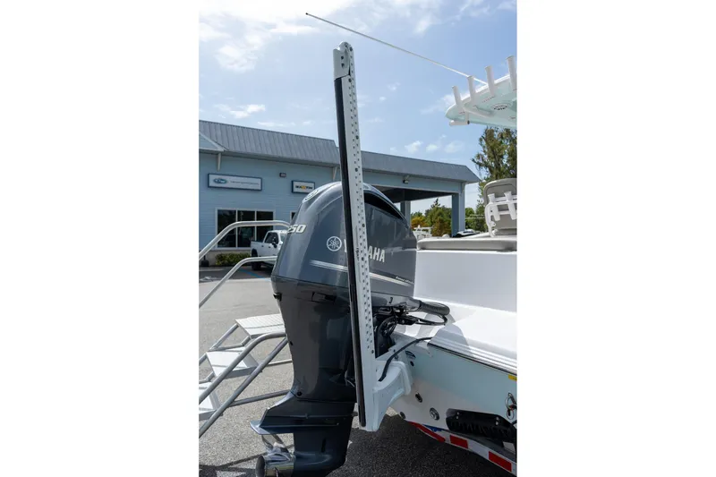 Slide: The Image of 2025 Sportsman Open 212 Center Console with Yamaha outboard motor in a marina setting. - 23