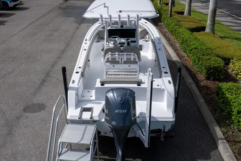 Slide: The Image of 2025 Sportsman Open 212 Center Console boat with Yamaha 250 engine, parked on pavement. - 3