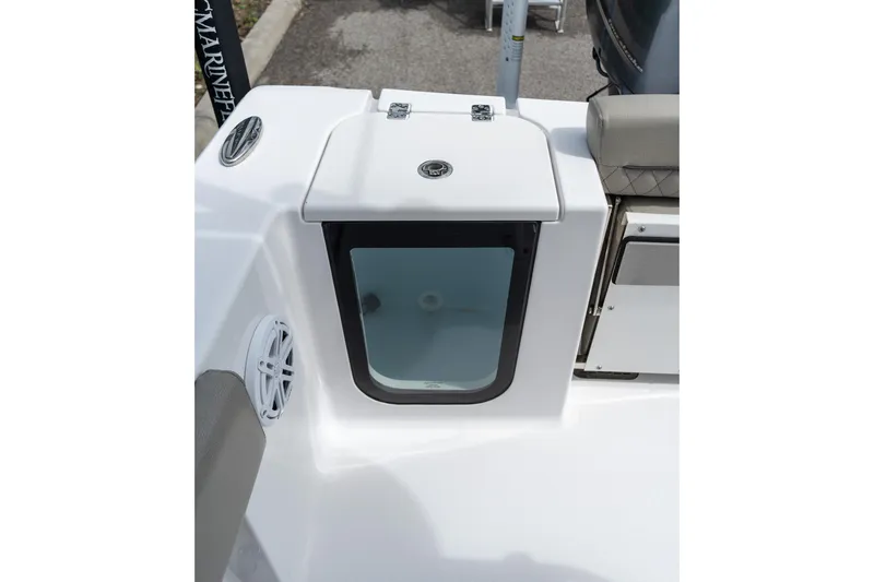 Slide: The Image of 2025 Sportsman Open 212 Center Console boat storage compartment with speaker detail. - 31