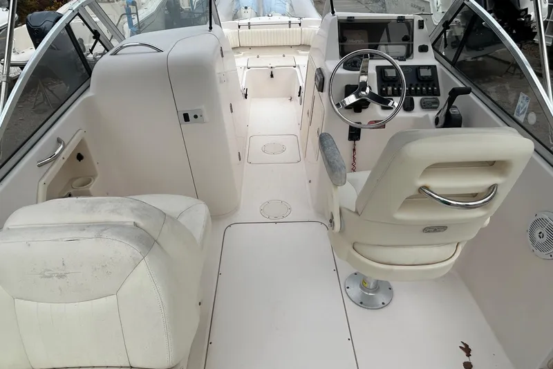 Slide: The Image of 2006 Grady-White Tournament 225 boat interior with steering wheel and seating. - 7