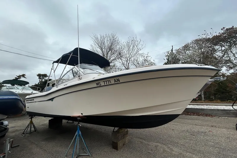 Slide: The Image of 2006 Grady-White Tournament 225 boat on stands, overcast sky background. - 8