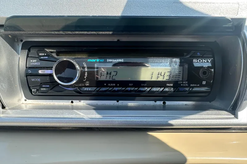 Slide: The Image of Sony marine stereo in a 2013 Sweetwater 2086 RE boat dashboard. - 10