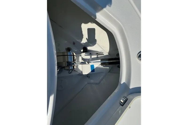 Slide: The Image of 2025 Sportsman Open 282 Center Console anchor compartment with stainless steel fittings. - 18