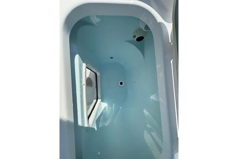 Slide: The Image of Livewell in 2025 Sportsman Open 282 Center Console boat, filled with water. - 25