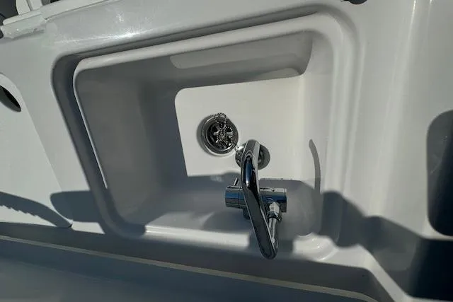 Slide: The Image of 2025 Sportsman Open 282 Center Console sink with chrome faucet detail. - 29