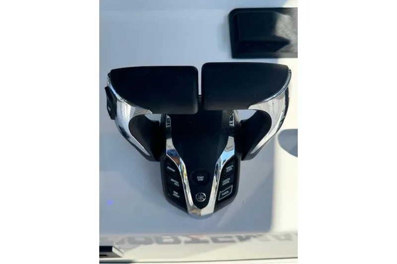 Slide: The Image of 2025 Sportsman Open 282 Center Console throttle controls with chrome and black finish. - 32