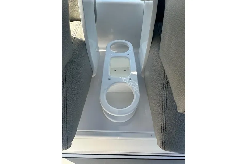 Slide: The Image of 2025 Sportsman Open 282 Center Console cup holders between seats. - 35