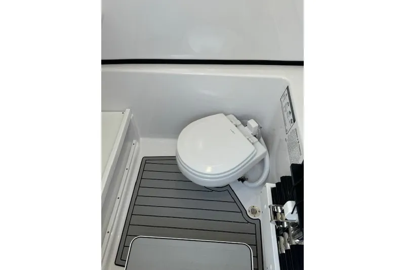 Slide: The Image of 2025 Sportsman Open 282 Center Console boat toilet interior. - 37