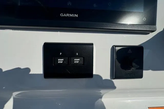 Slide: The Image of Control panel of a 2025 Sportsman Open 282 Center Console with Garmin display. - 39