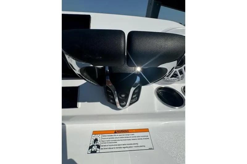 Slide: The Image of 2025 Sportsman Open 282 Center Console throttle controls with warning label. - 40