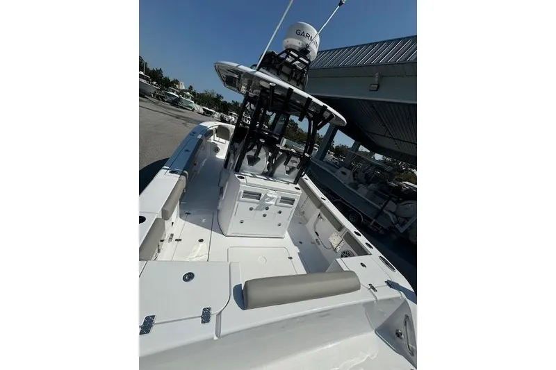Slide: The Image of 2025 Sportsman Open 282 Center Console boat, featuring spacious deck and modern console. - 8