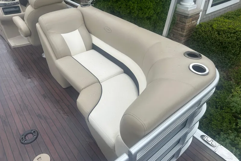 Slide: The Image of Luxurious seating on 2013 Harris Solstice 220 pontoon boat with cup holders and sleek design. - 12