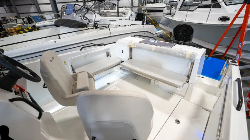 Slide: The Image of 2023 Beneteau Flyer 8 SPACEdeck interior with seating in a showroom. - 12