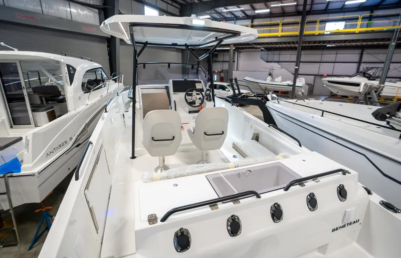 Slide: The Image of 2023 Beneteau Flyer 8 SPACEdeck boat in showroom, rear view of cockpit and seating. - 5