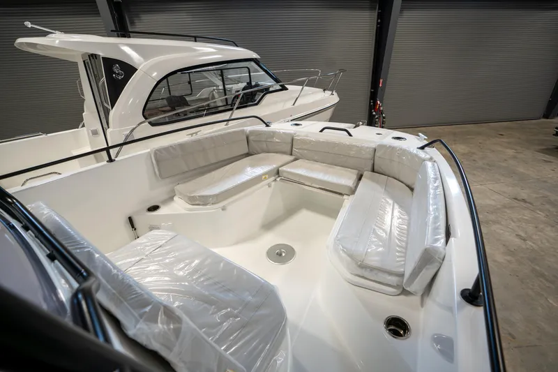 Slide: The Image of 2023 Beneteau Flyer 8 SPACEdeck boat with spacious seating in a showroom. - 26