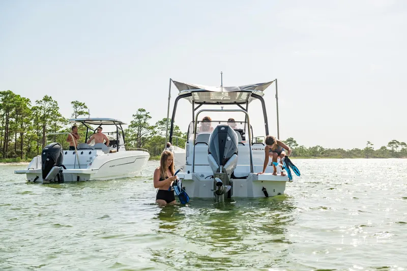Slide: The Image of 2023 Beneteau Flyer 8 SPACEdeck boats with people enjoying water activities. - 18