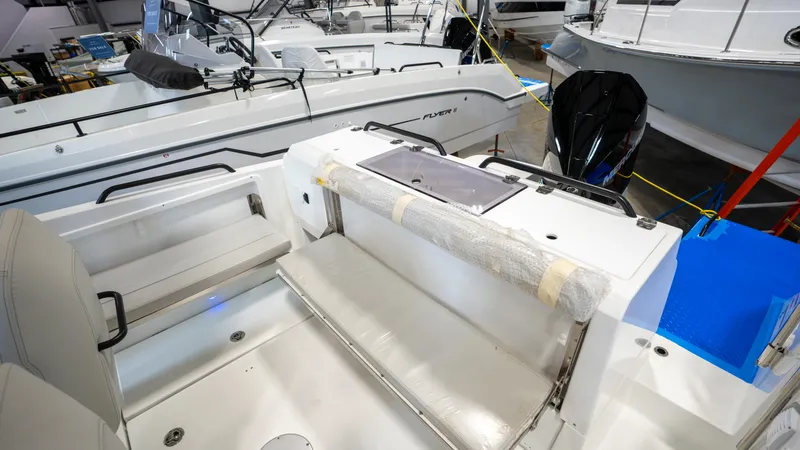 Slide: The Image of 2023 Beneteau Flyer 8 SPACEdeck boat interior with seating and storage. - 14