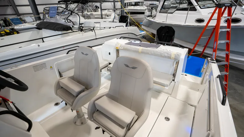 Slide: The Image of 2023 Beneteau Flyer 8 SPACEdeck interior with dual seats in a showroom. - 11
