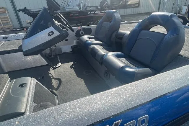 Slide: The Image of 2012 Skeeter ZX20 boat interior with blue seats and steering console. - 5