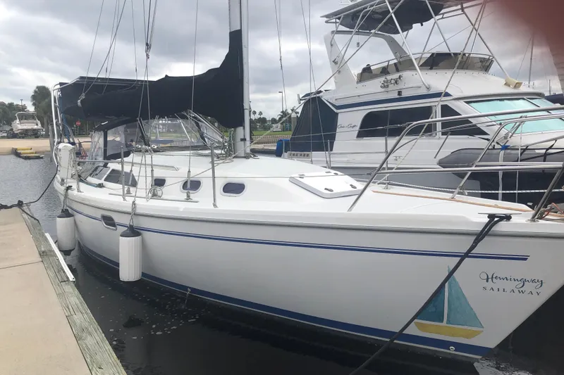 The Image of 2001 Catalina 34 Mk II sailboat docked at marina, overcast sky. - 1