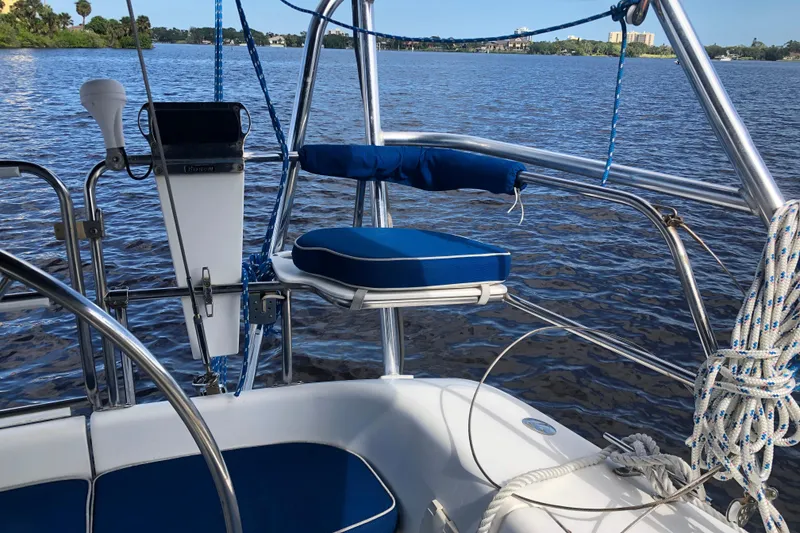 Slide: The Image of Cockpit of 2001 Catalina 34 Mk II sailboat with blue cushions and scenic water view. - 3