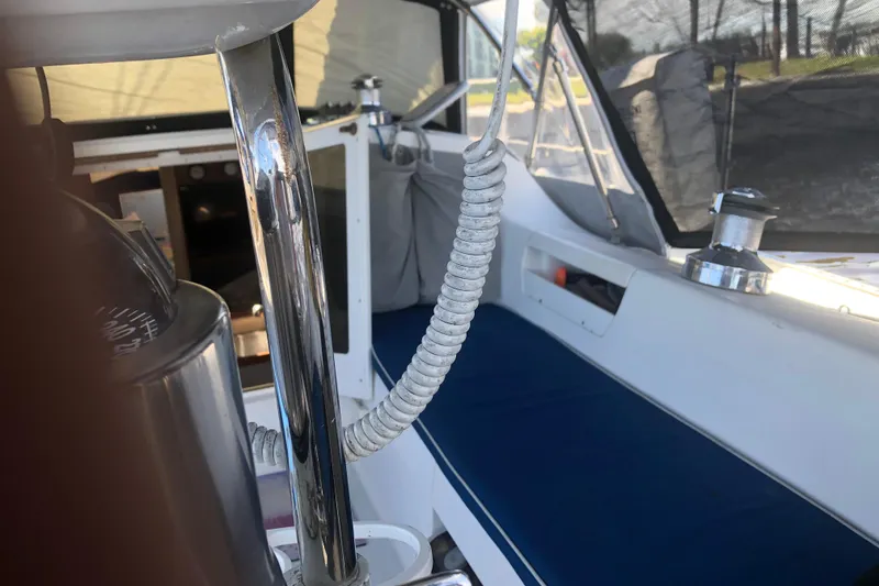 Slide: The Image of Interior view of a 2001 Catalina 34 Mk II sailboat cockpit with blue seating. - 7