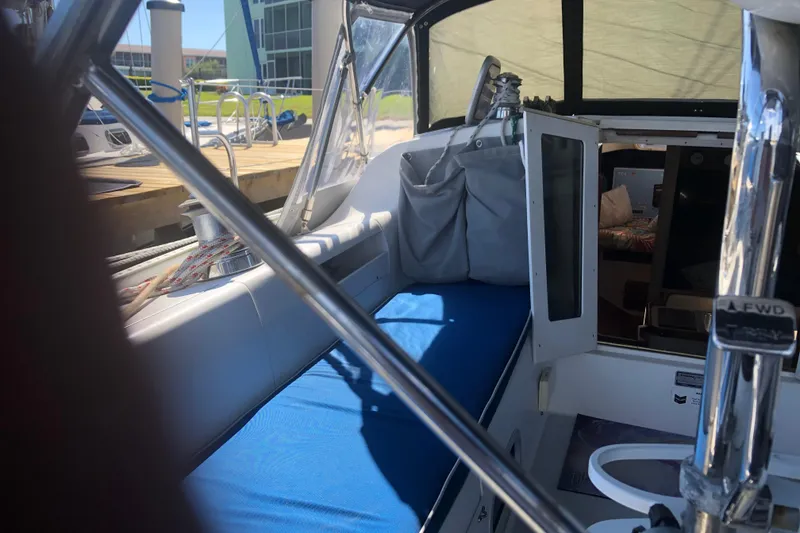 Slide: The Image of Interior view of a 2001 Catalina 34 Mk II sailboat cockpit with blue seating. - 8