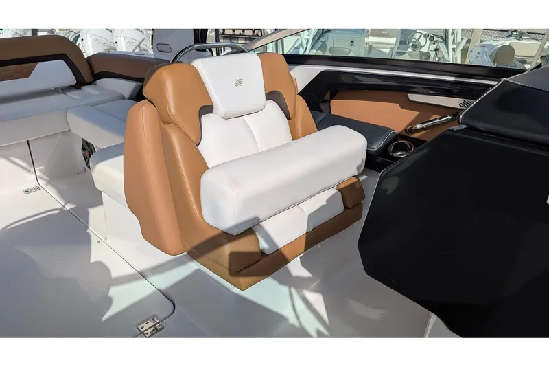 Slide: The Image of 2019 Four Winns H290 OB boat interior with tan and white seating. - 13