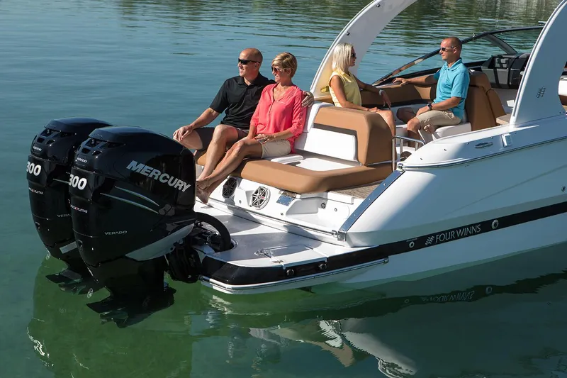 Slide: The Image of Manufacturer Provided Image: 2019 Four Winns Horizon H290 OB boat with passengers on calm water. - 29