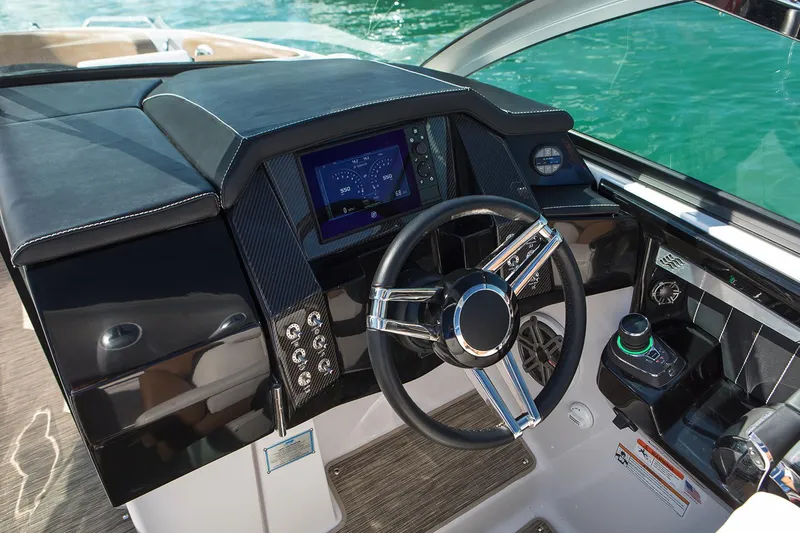 Slide: The Image of Manufacturer Provided Image: 2019 Four Winns Horizon H290 OB boat dashboard with steering wheel and navigation display. - 33