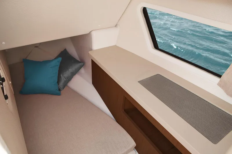 Slide: The Image of Manufacturer Provided Image: 2019 Four Winns Horizon H290 OB cabin interior with bed, pillows, and window view of the sea. - 37