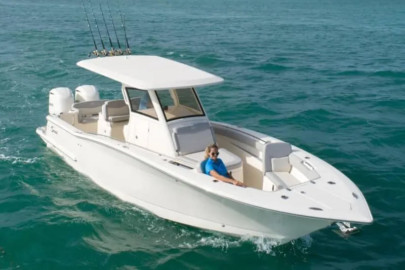 The Image of Manufacturer Provided Image: 2025 Scout 305 LXF boat cruising on clear blue water. - 0