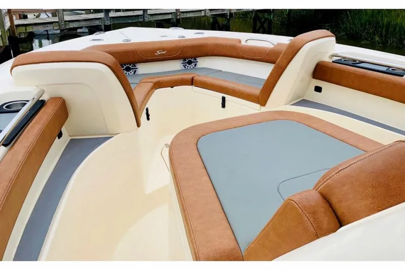 Slide: The Image of Manufacturer Provided Image: Luxurious 2025 Scout 305 LXF boat interior with tan and gray seating. - 4