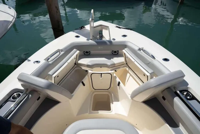Slide: The Image of Manufacturer Provided Image: 2025 Scout 305 LXF boat interior with cushioned seating and storage compartments. - 6