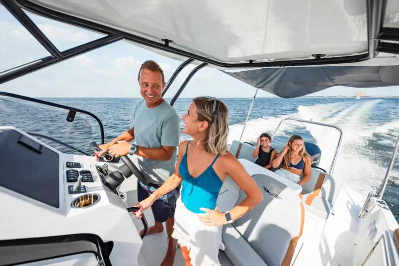 Slide: The Image of 2023 Beneteau Flyer 8 SUNdeck cruising with passengers, showcasing modern design and comfort. - 1